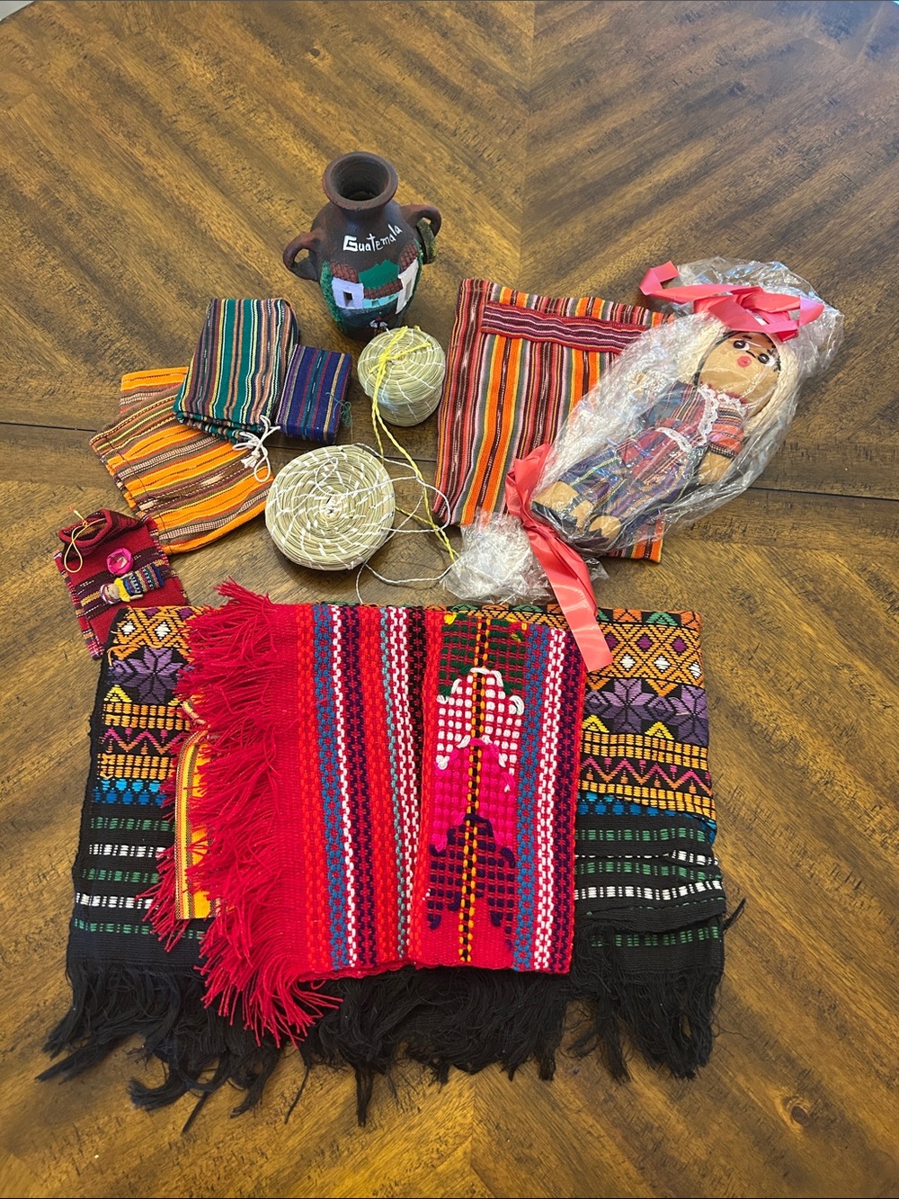Guatemalan Textiles, baskets, vase and doll.
